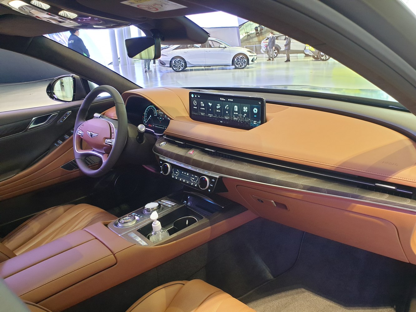 Tan leather interior with digital dashboard and touchscreen display