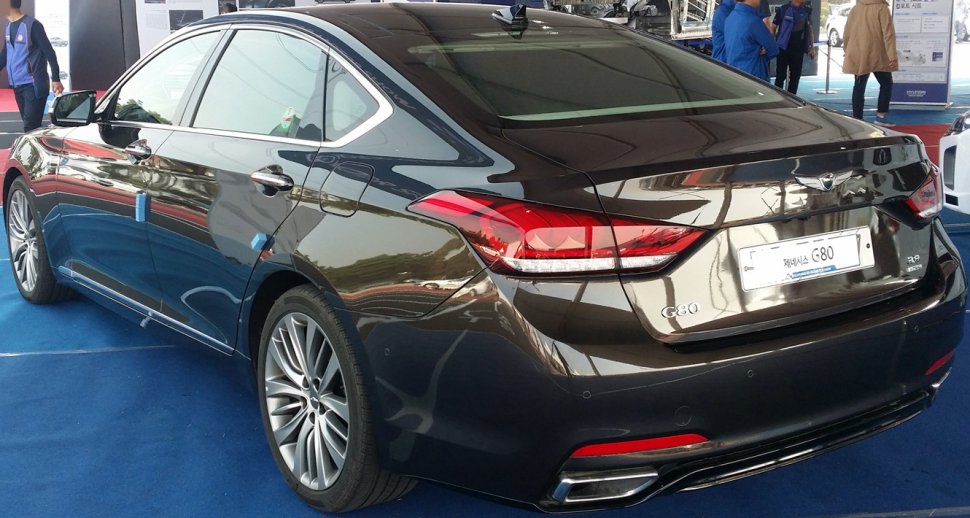 Rear view of a luxury sedan with sleek taillights and dual exhausts
