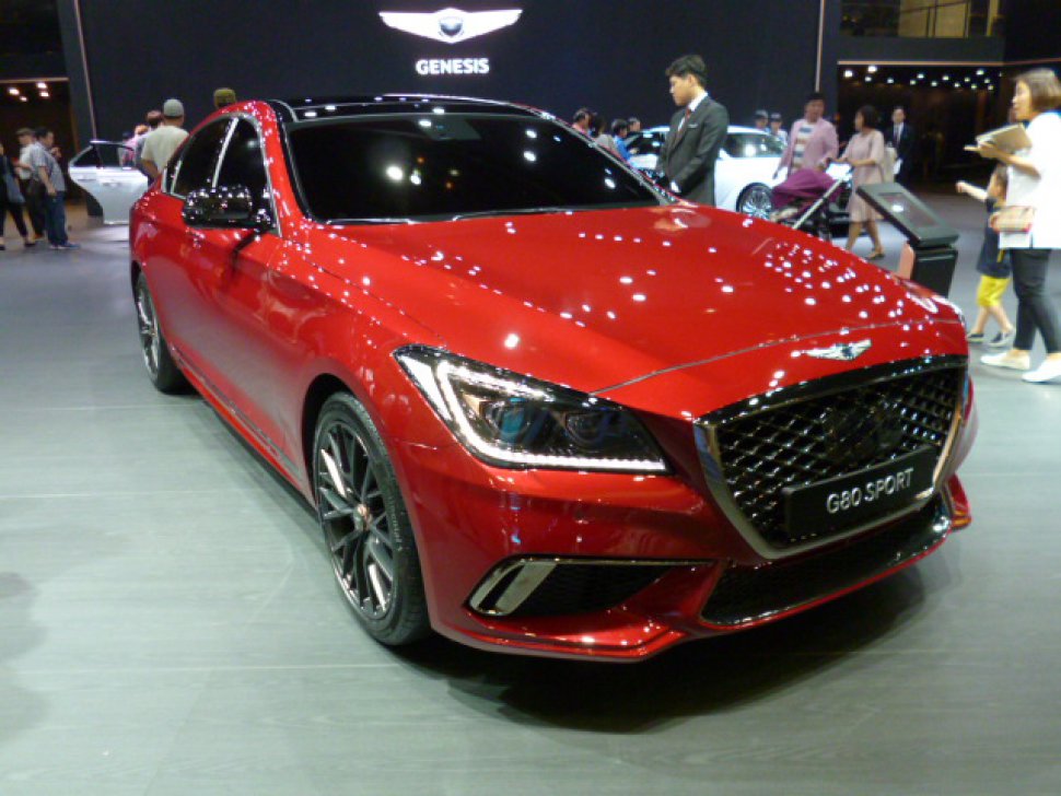 Sporty sedan front with aggressive grille and LED headlights