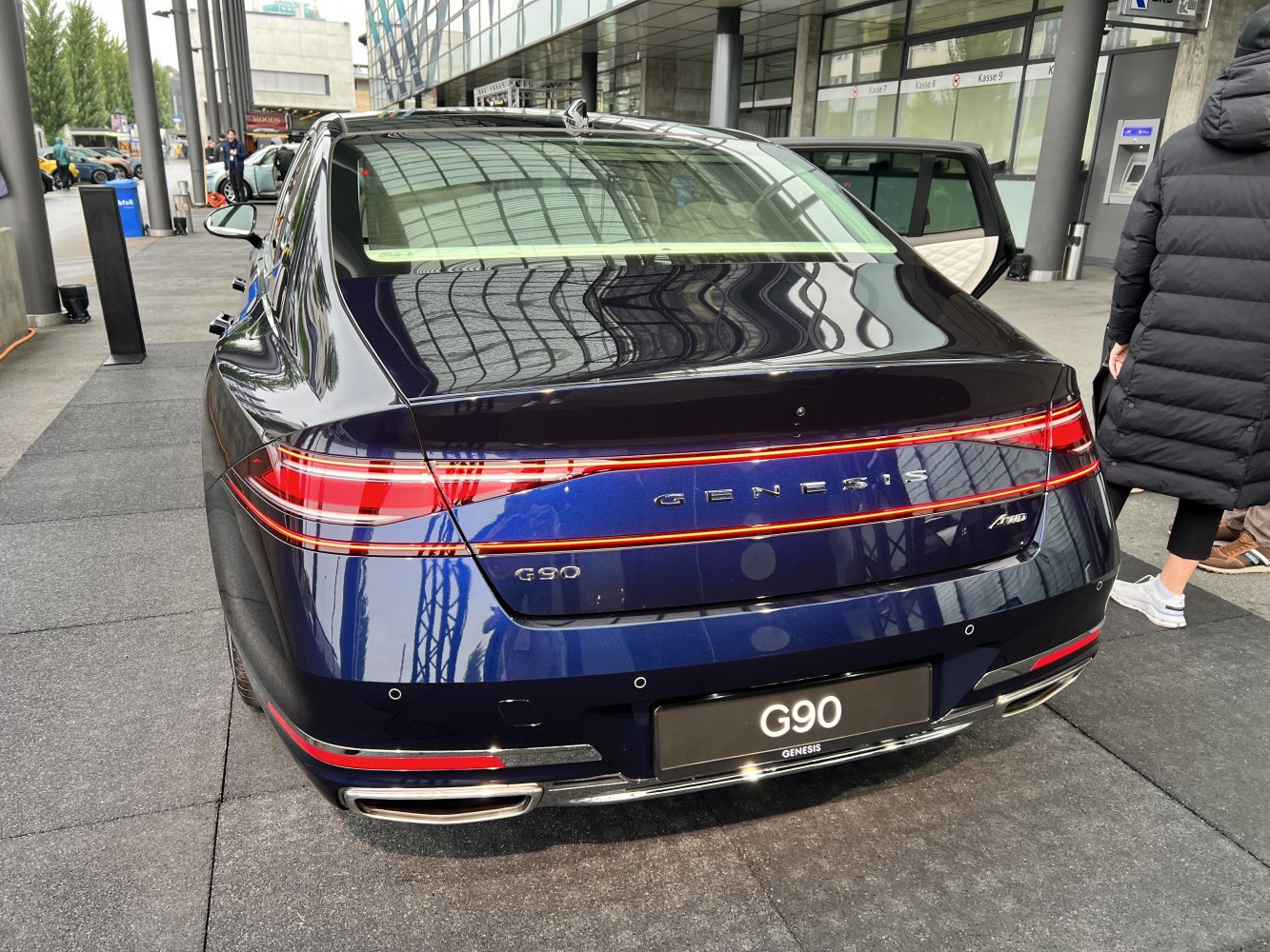 Luxury sedan rear with LED tail lights and dual exhausts