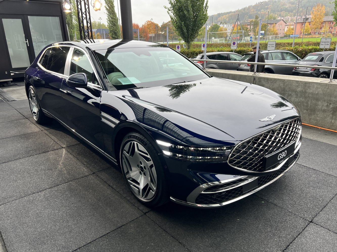 Luxury sedan with chrome front grille and multi-segment LED headlights