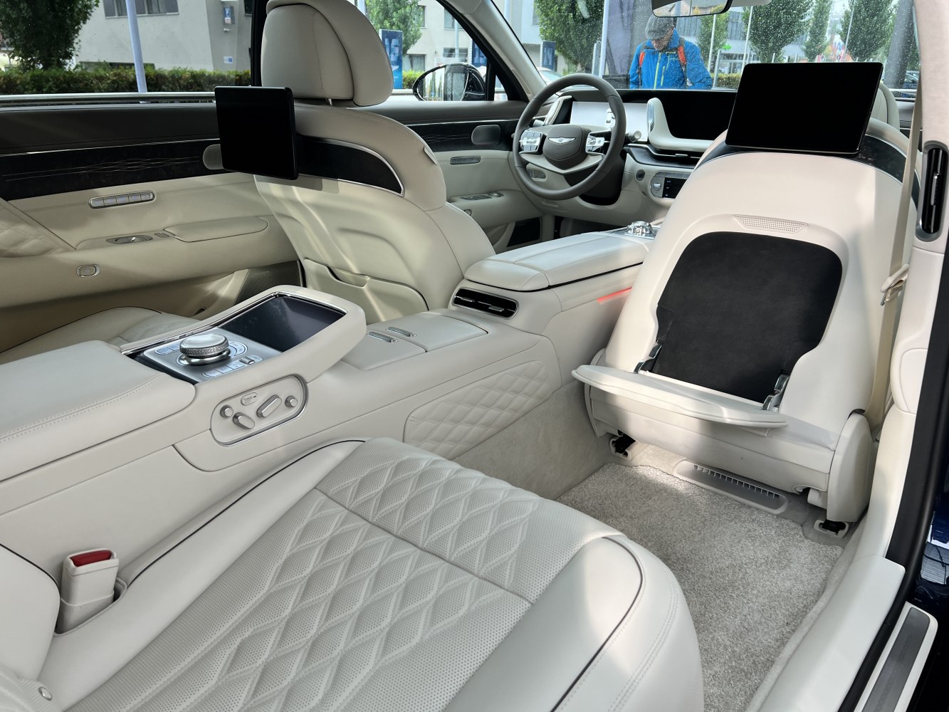 Luxury rear cabin with reclining seats and dual entertainment screens