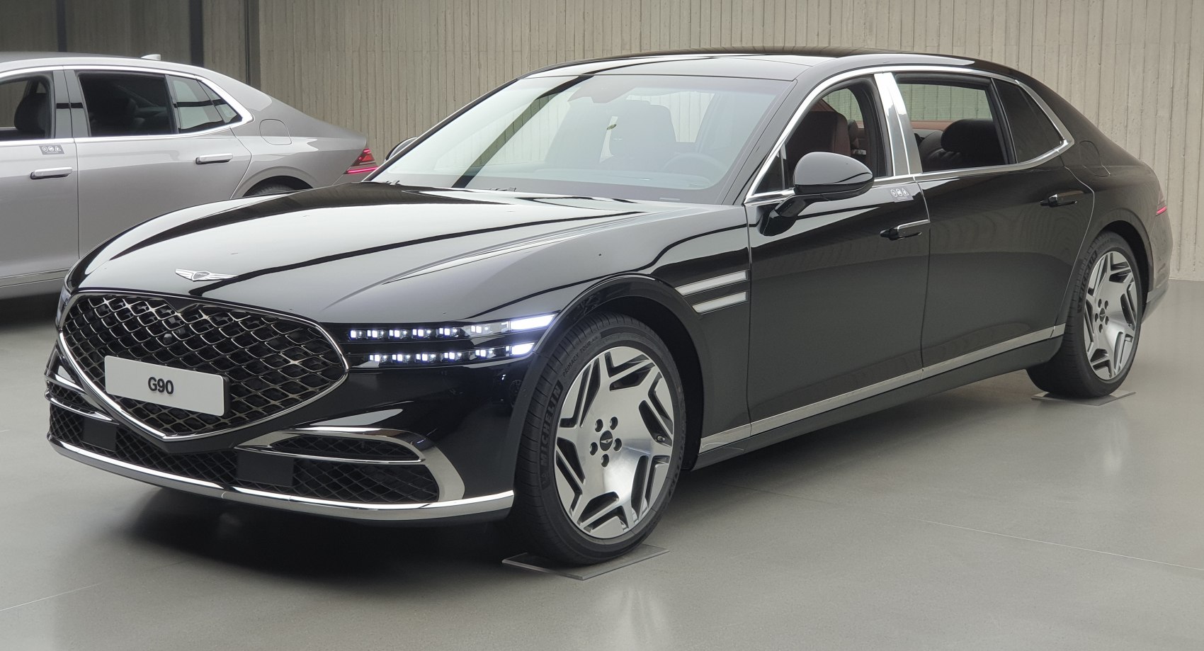 Luxury sedan with LED headlights and distinctive front grille in black