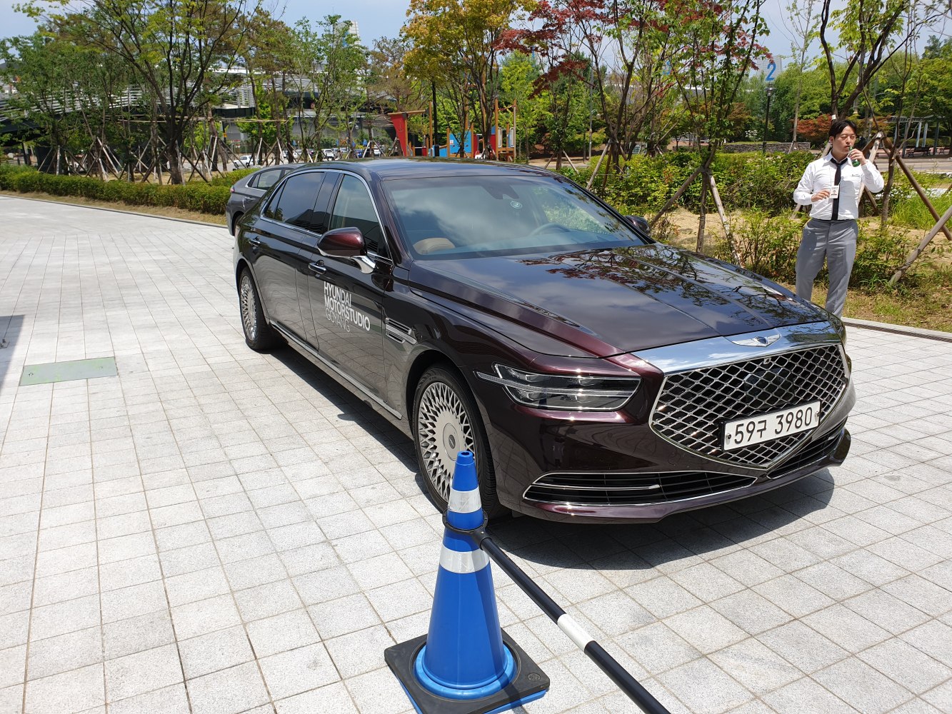 Luxury sedan with distinctive front grille and multi-spoke alloy wheels