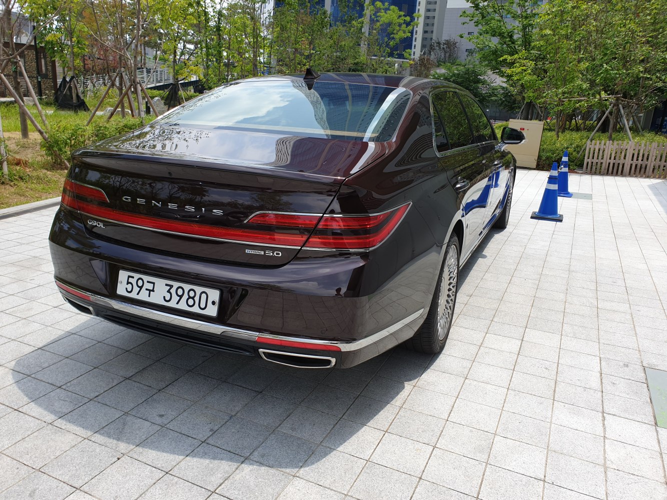 Rear view of luxury sedan with distinctive LED taillights and dual exhaust outlets