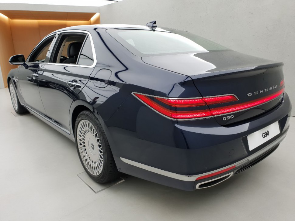 Rear and side view with distinctive taillights and alloy wheels