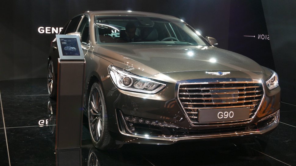 Large chrome front grille and sleek LED headlights with modern bumper