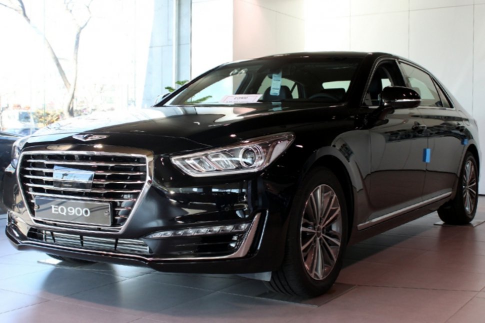 Luxury sedan front side with prominent grille and sharp headlights