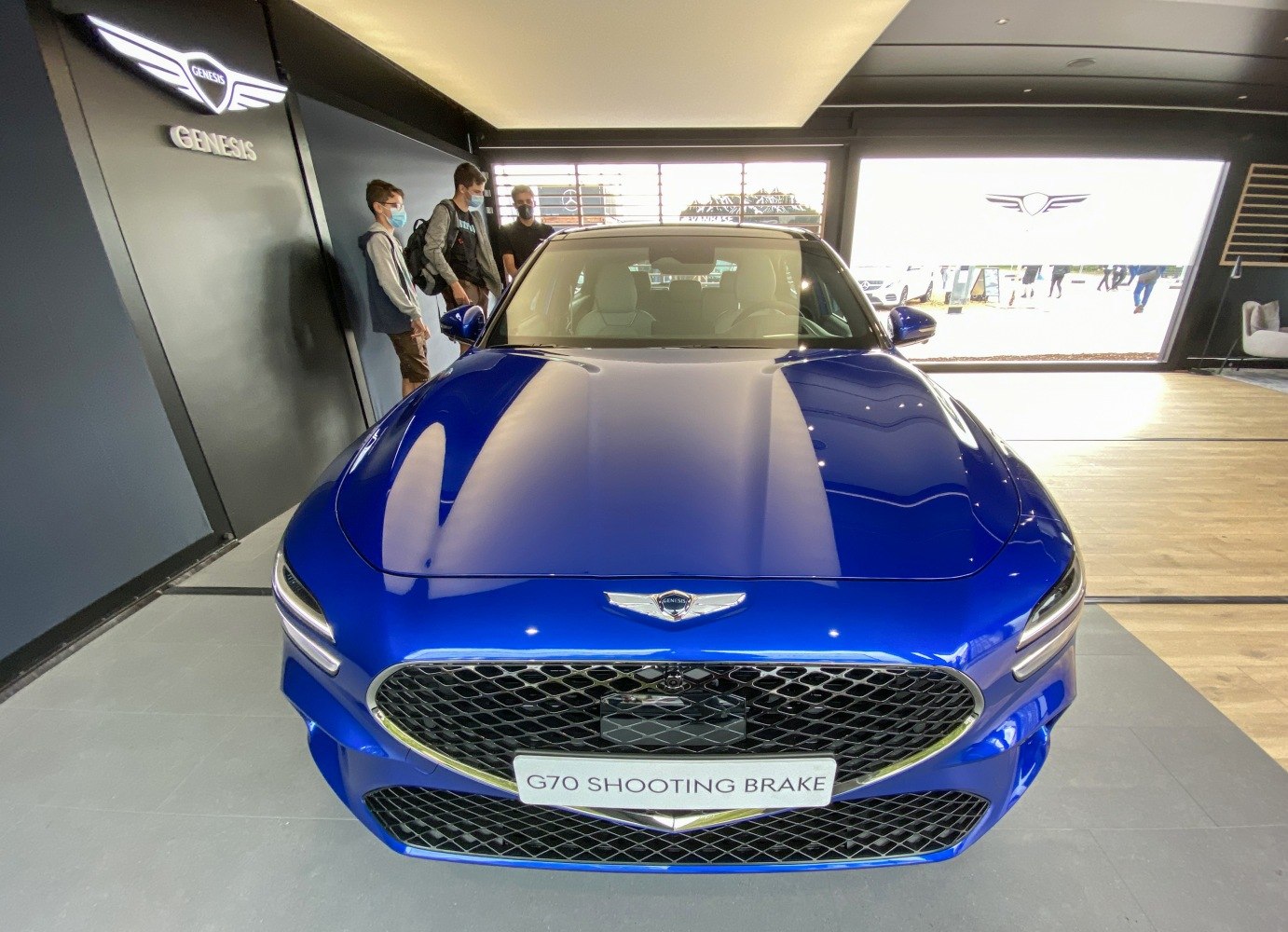 Front view with signature mesh grille and sleek hood design