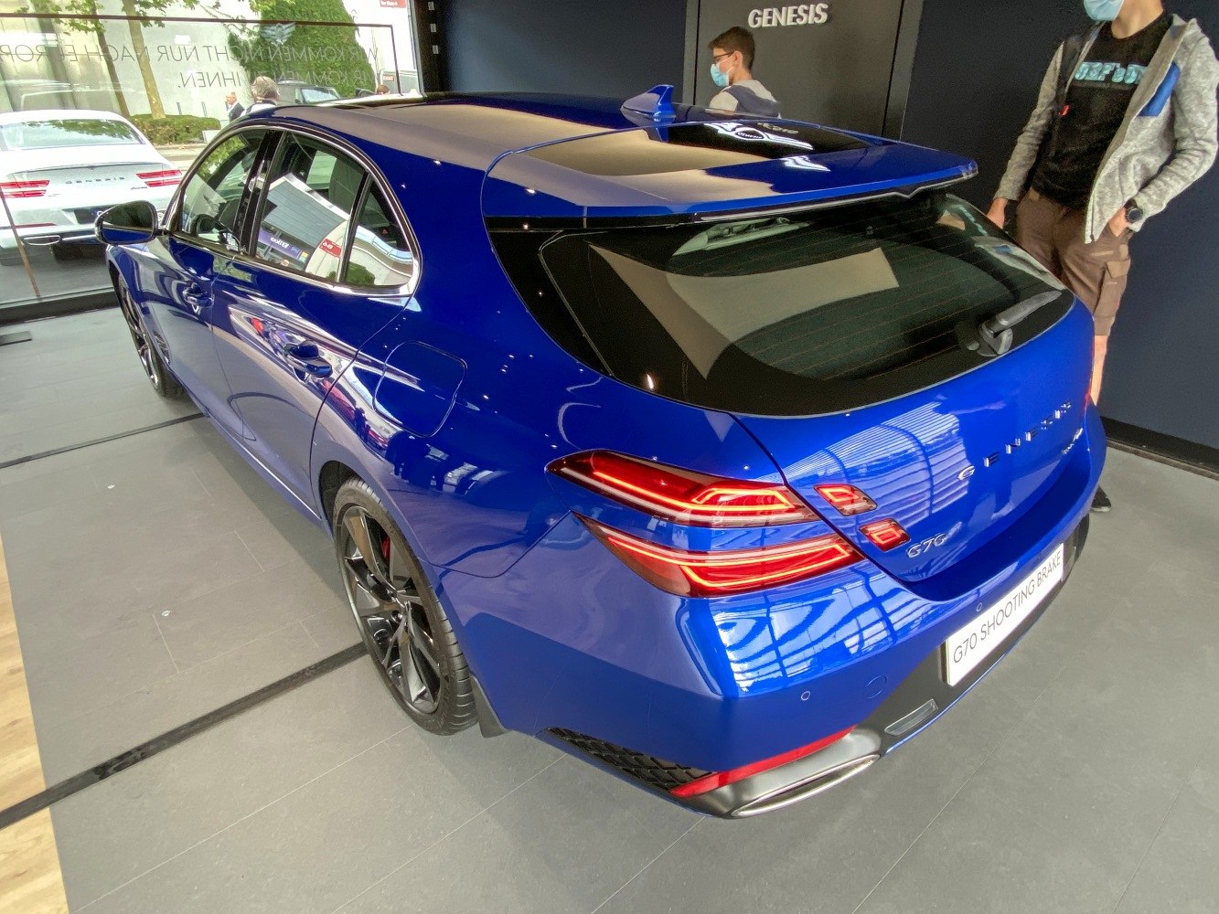 Rear and side view of a modern sporty shooting brake with distinct tail lights