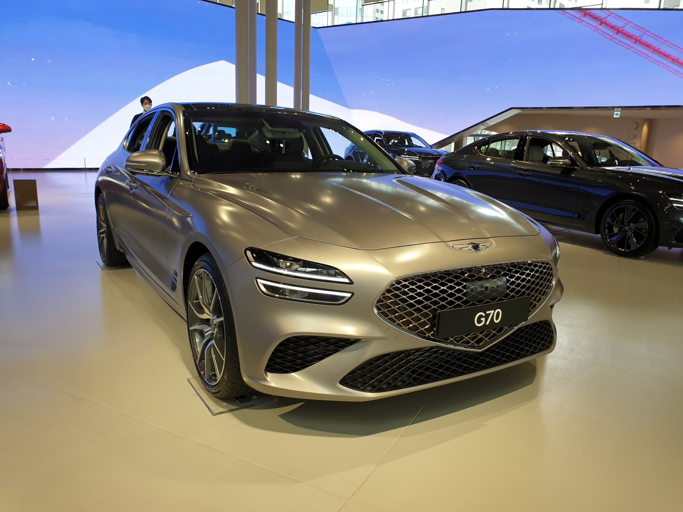Modern front grille and sleek LED headlights on luxury sedan