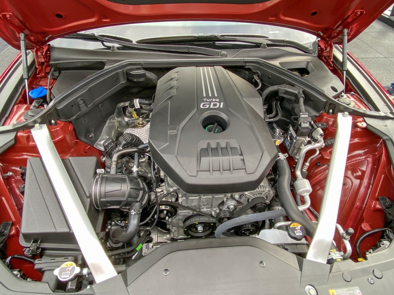Turbocharged GDI engine with visible components under hood.