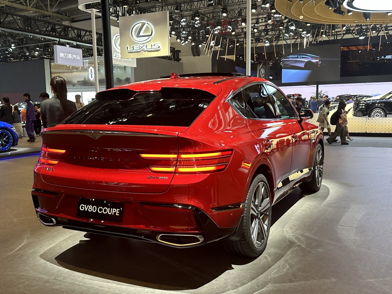 Rear design with LED tail lights and dual exhaust of a luxury coupe SUV