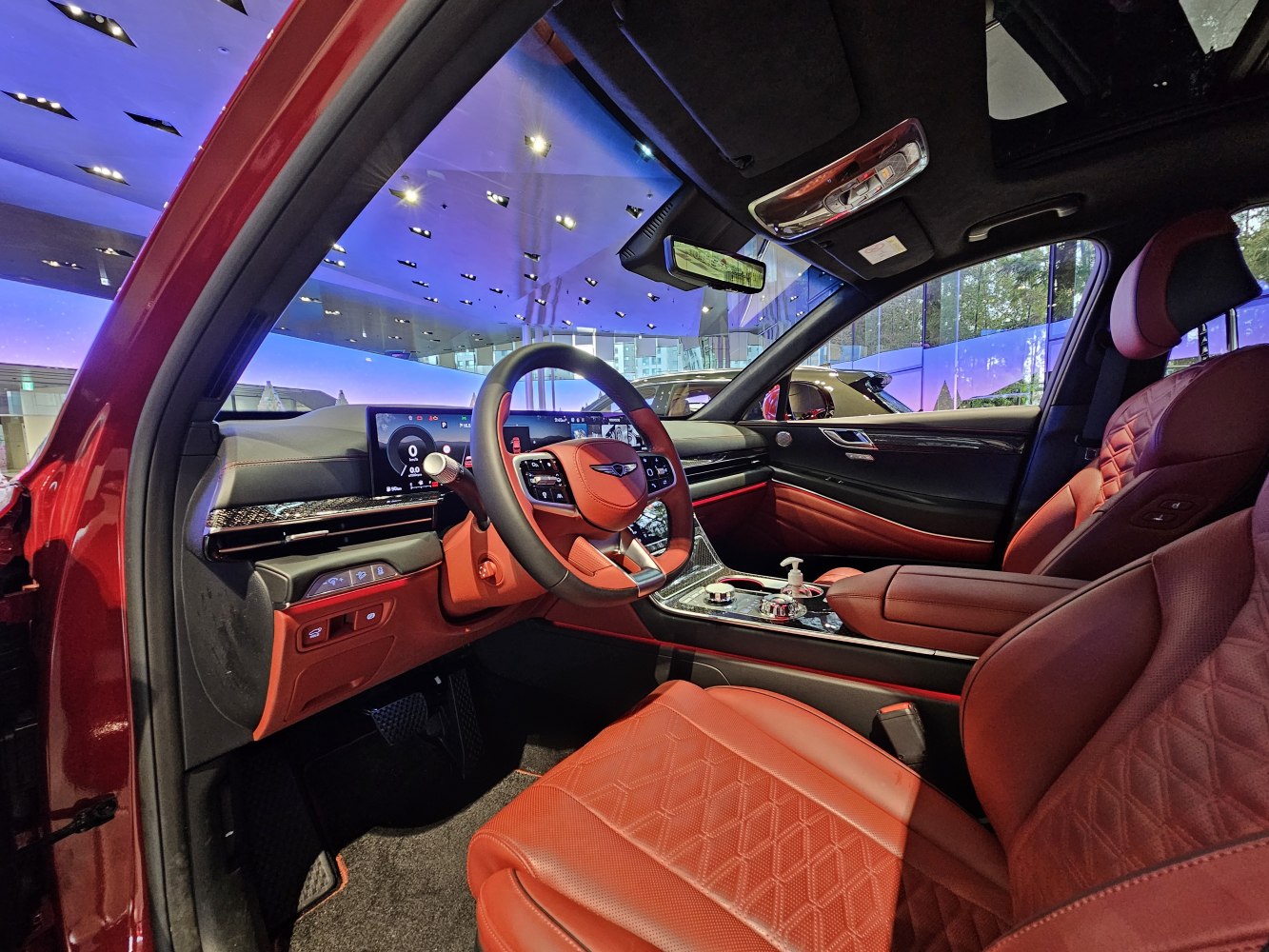 Luxury red leather seats and digital instrument cluster in modern SUV interior