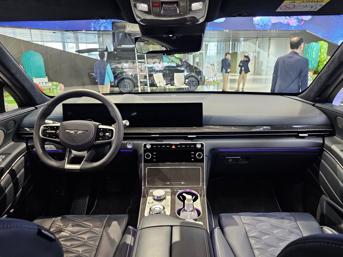 Luxury car interior with advanced dashboard and quilted leather seats
