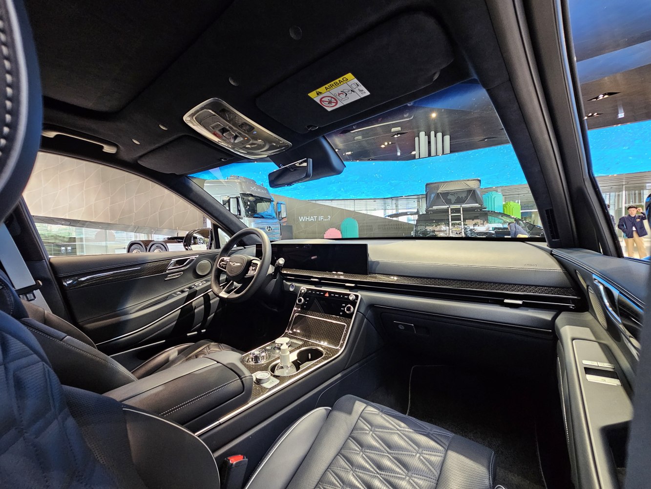 Luxury modern car interior with digital dashboard and premium quilted leather seats