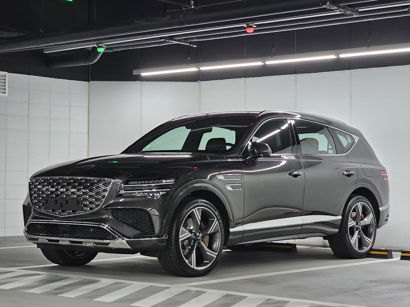 Distinctive large grille and sharp LED headlights on a luxury SUV.