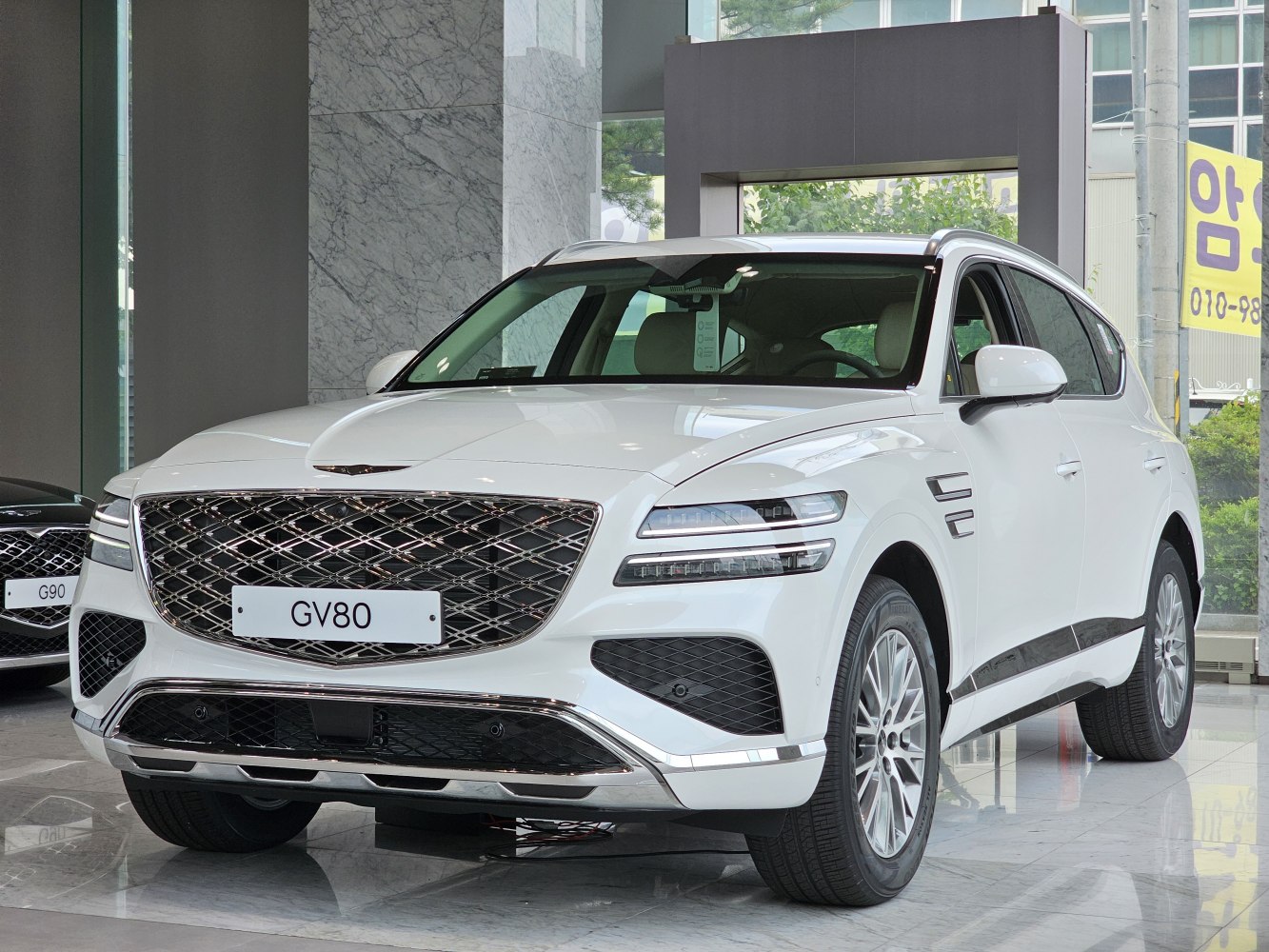 Prominent front grille and sleek dual LED headlights on a luxury SUV.
