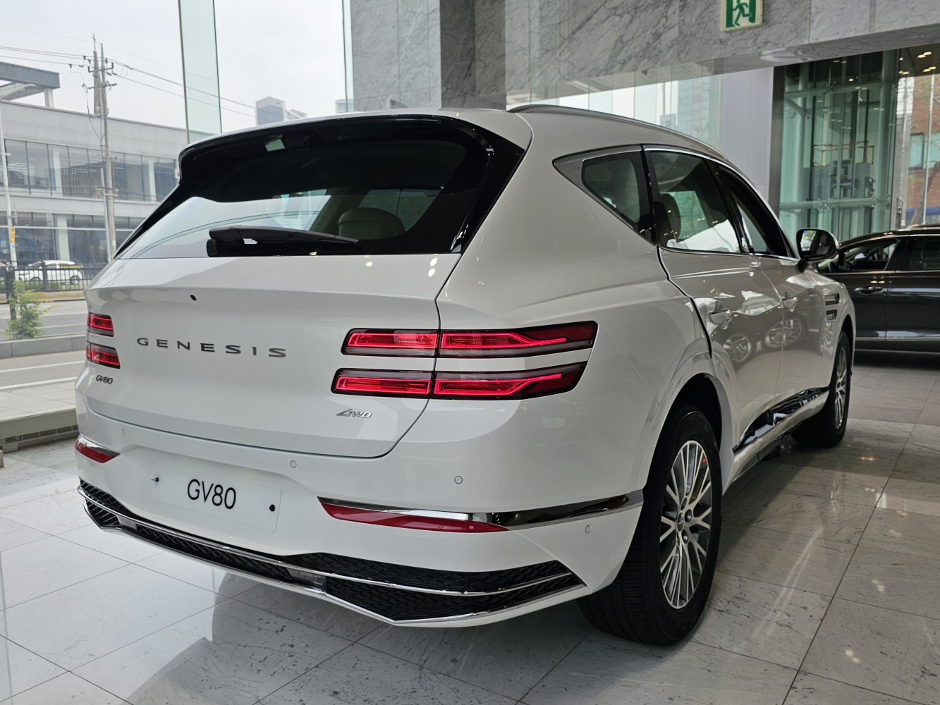 Rear view of luxury SUV with sleek LED tail lights and all-wheel drive badge