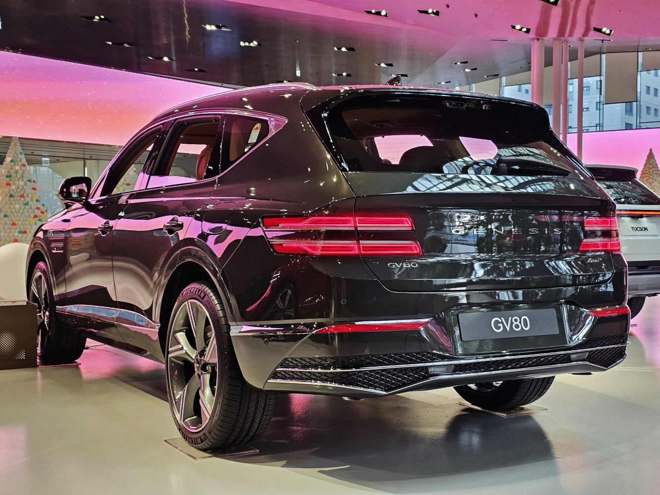 Rear view of a modern SUV with horizontal LED taillights and sporty rear bumper.