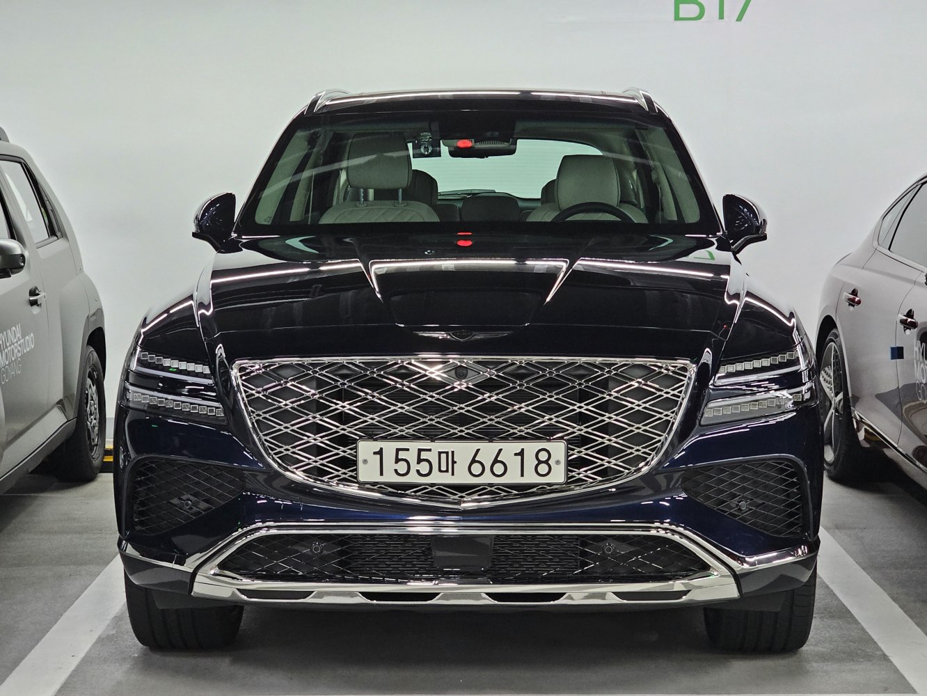 Front grille and LED headlights of a luxury SUV facelift model.