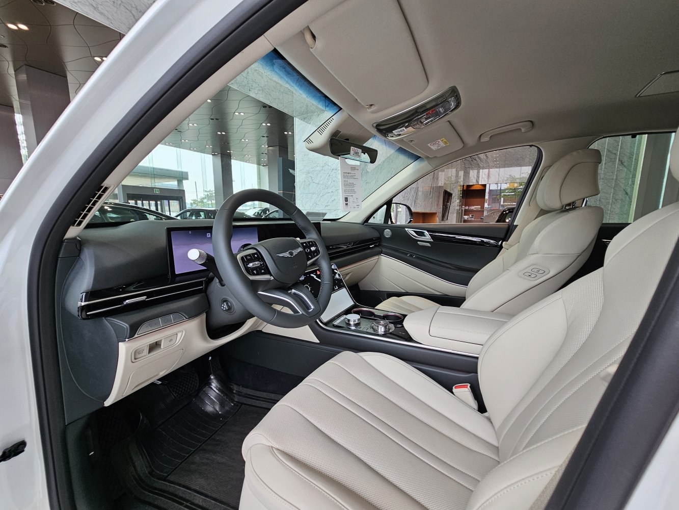 Luxury interior with digital dashboard and plush leather seats.