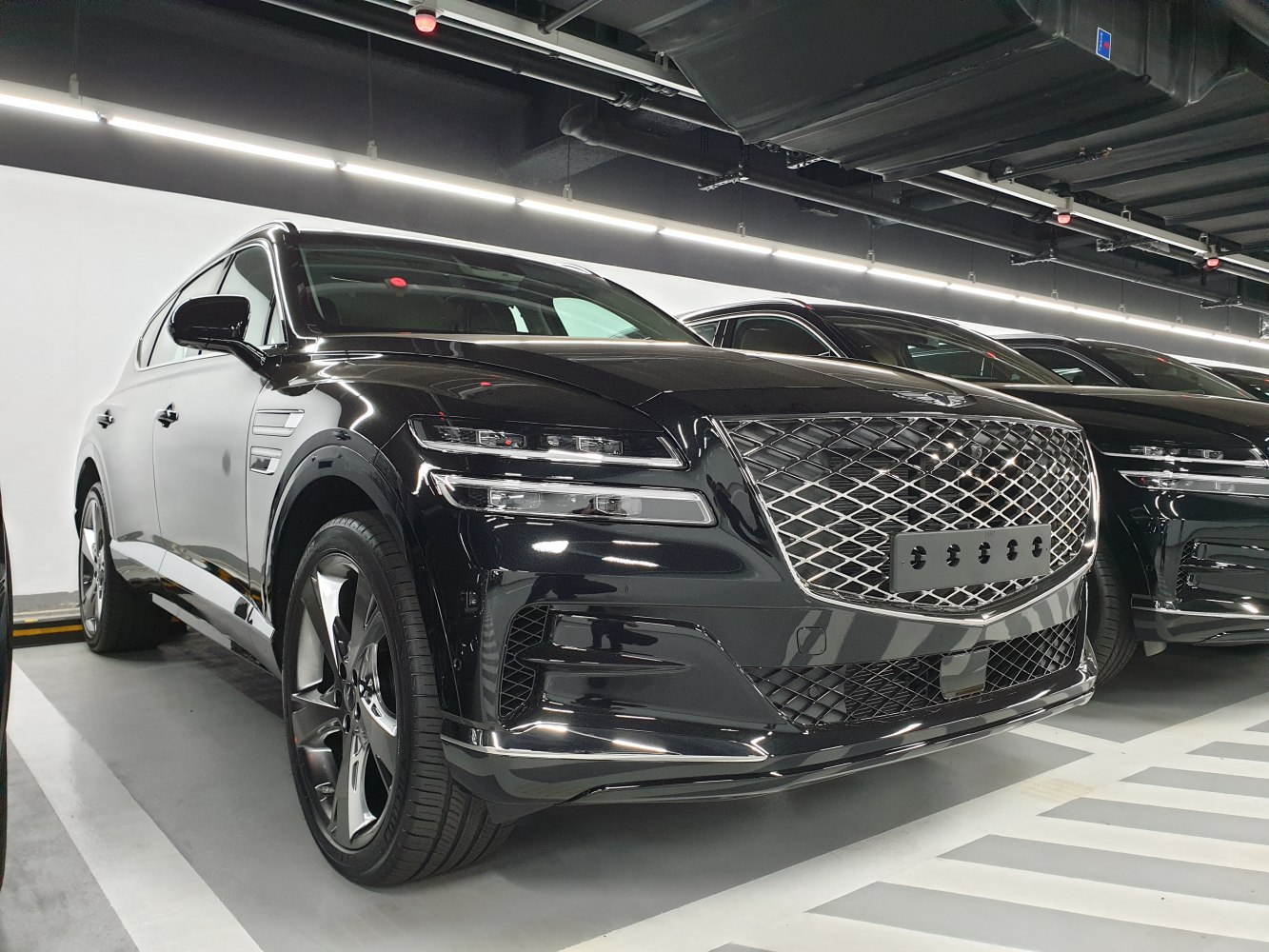 Luxury SUV front grille with distinctive split headlights
