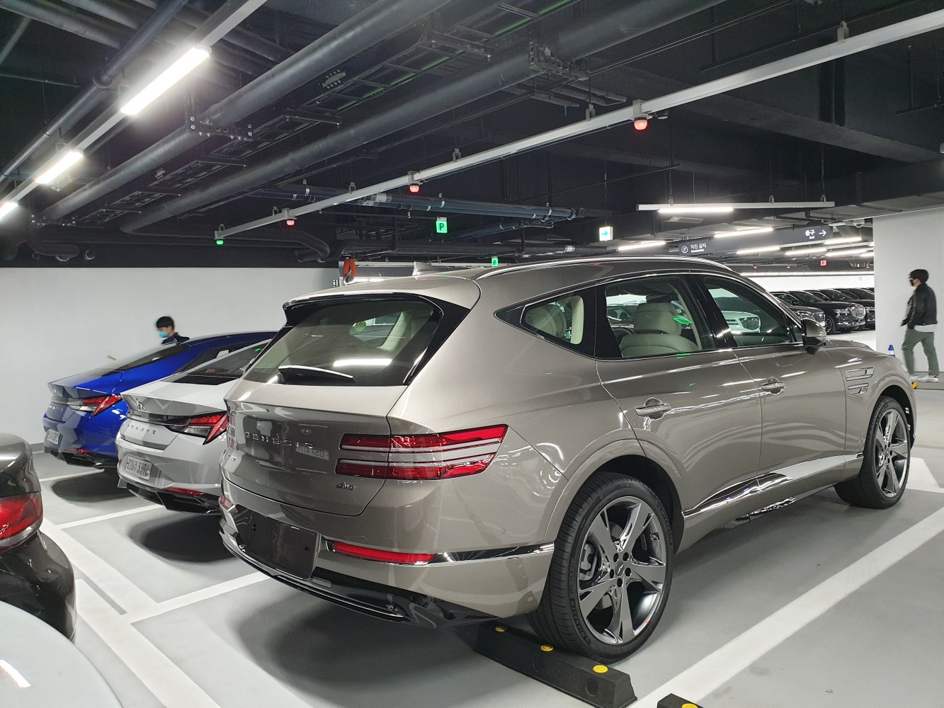 Luxury SUV rear and side profile with sharp taillights and alloy wheels.