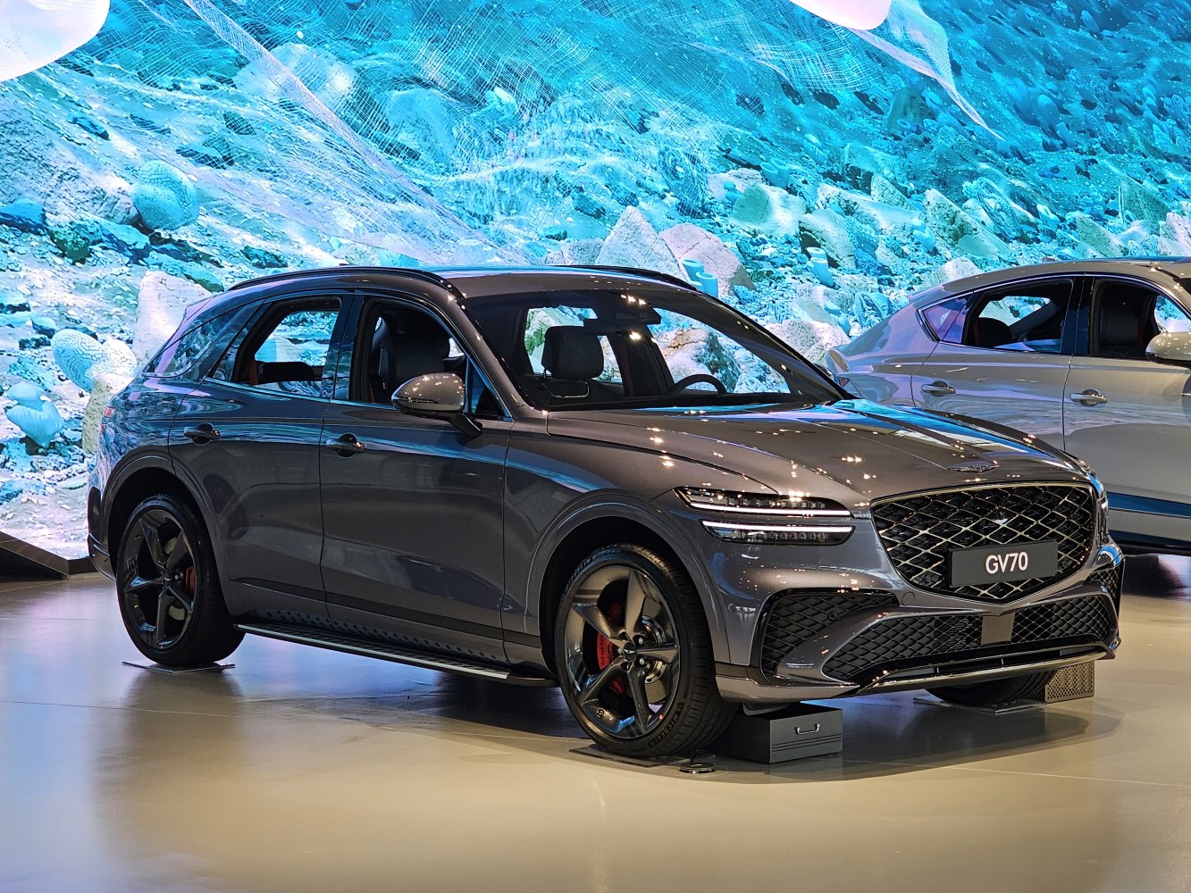 Front side view of a modern SUV with sporty grille and sleek headlights