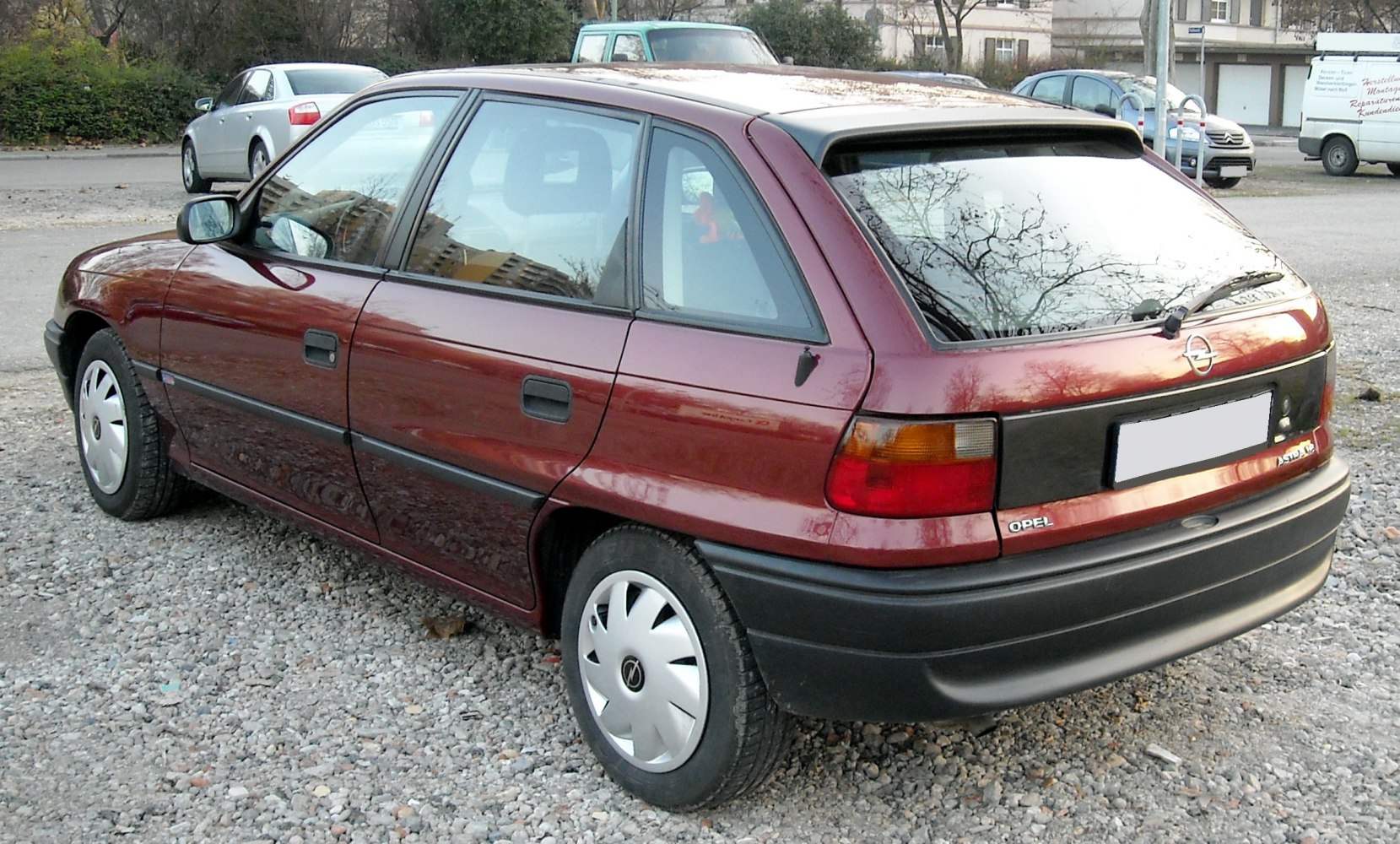 Rear and side profile of a 1994 hatchback with distinctive taillights