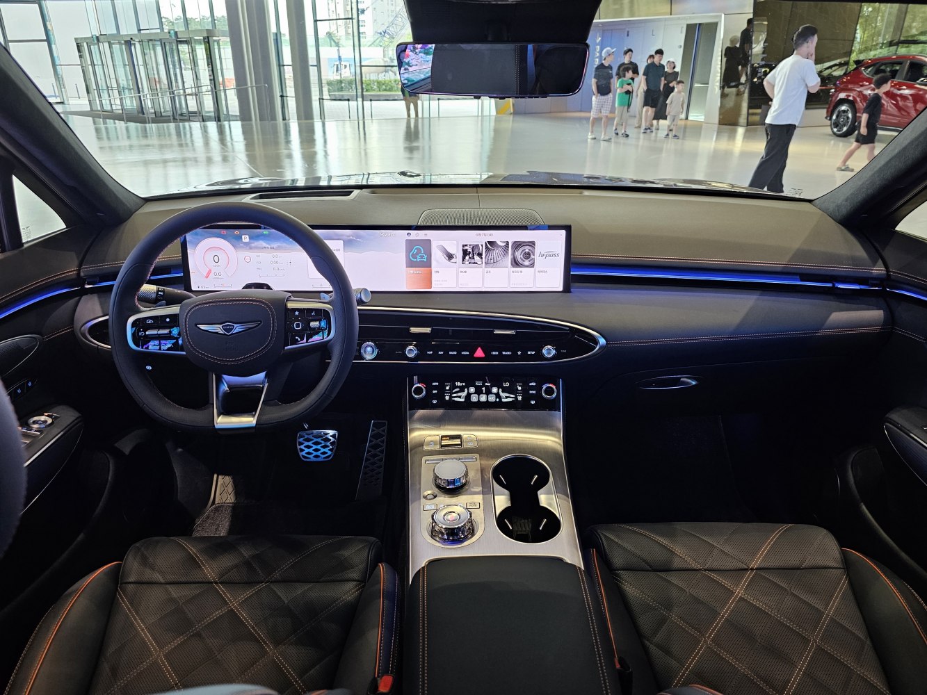 Luxury interior with dual digital displays and premium center console controls