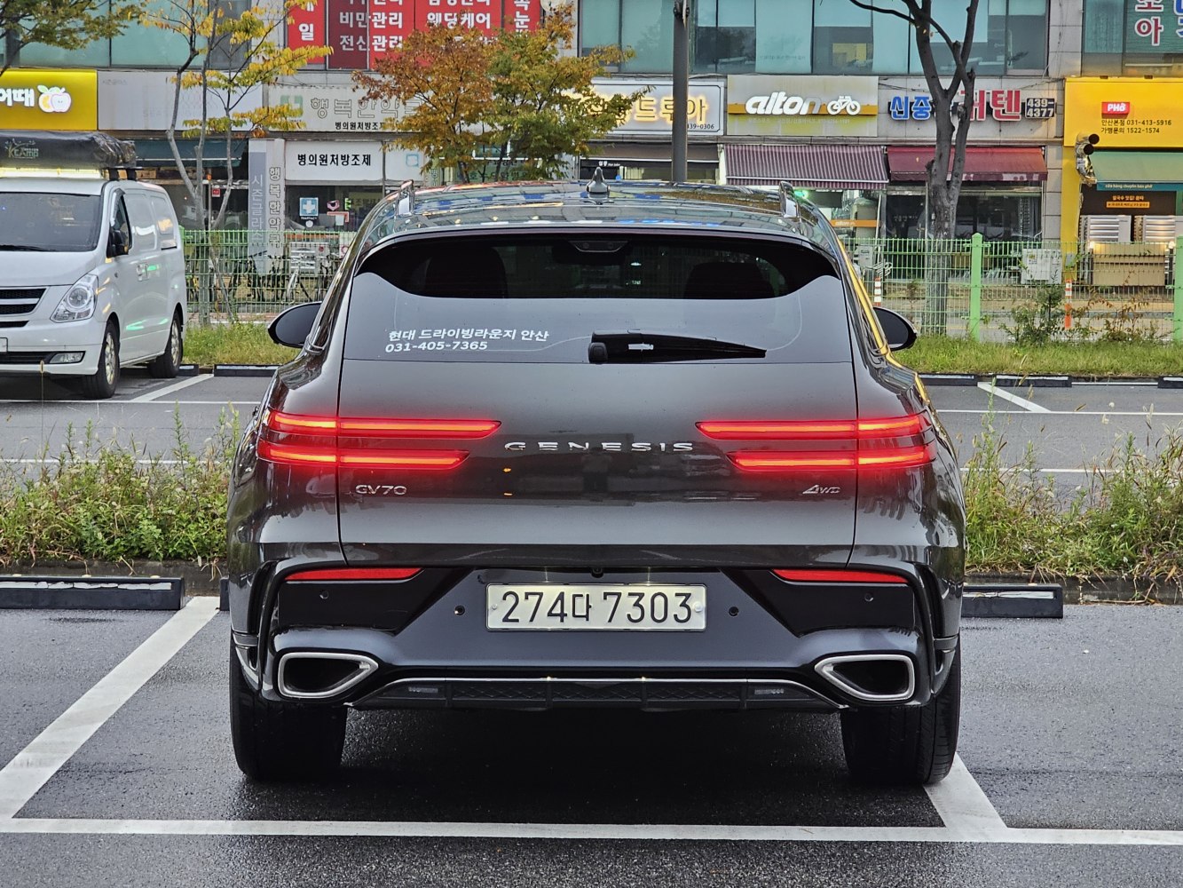 Rear view featuring sleek LED tail lights and dual exhaust outlets