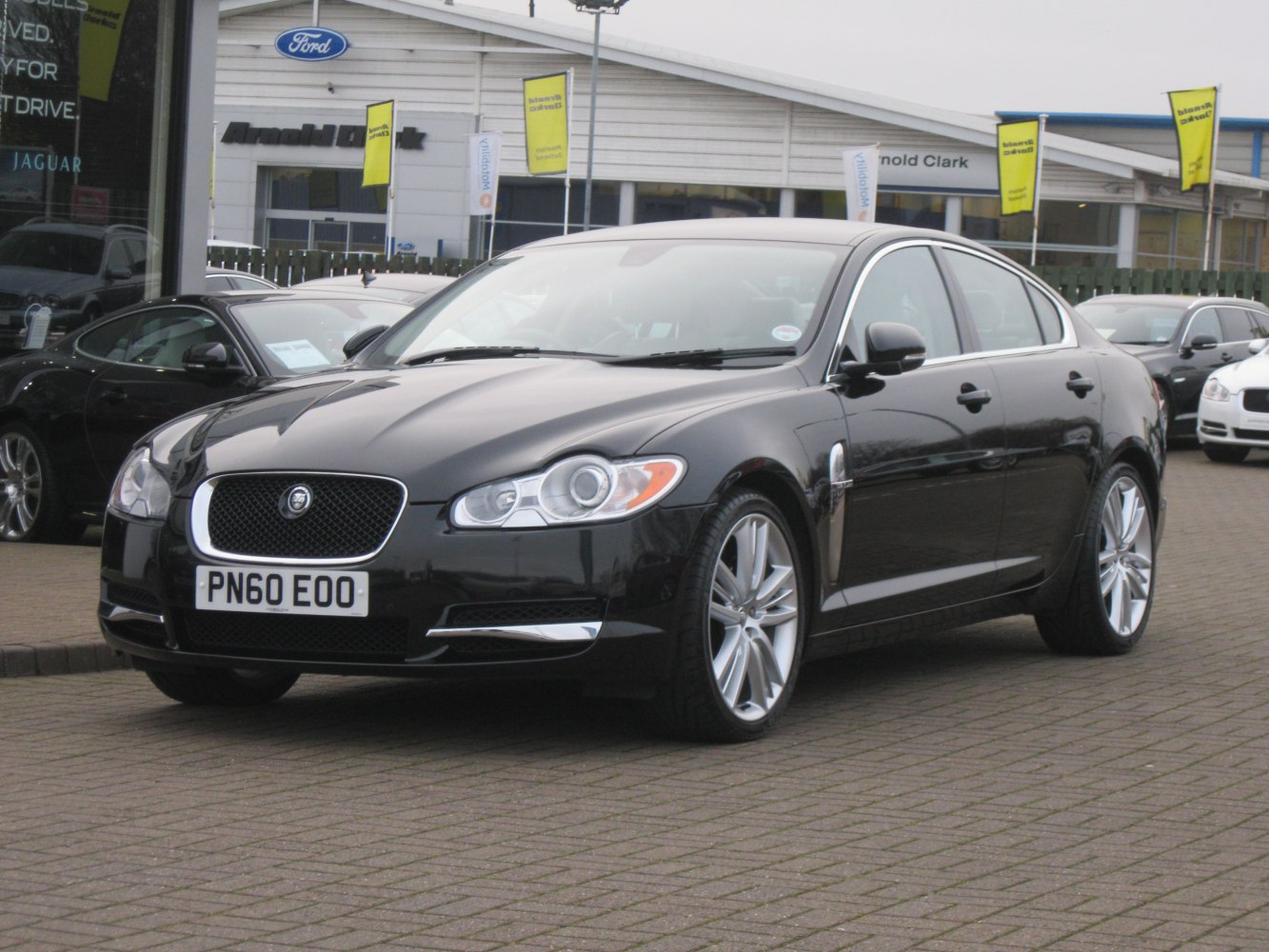 Front view of luxury sedan with distinctive grille and headlights