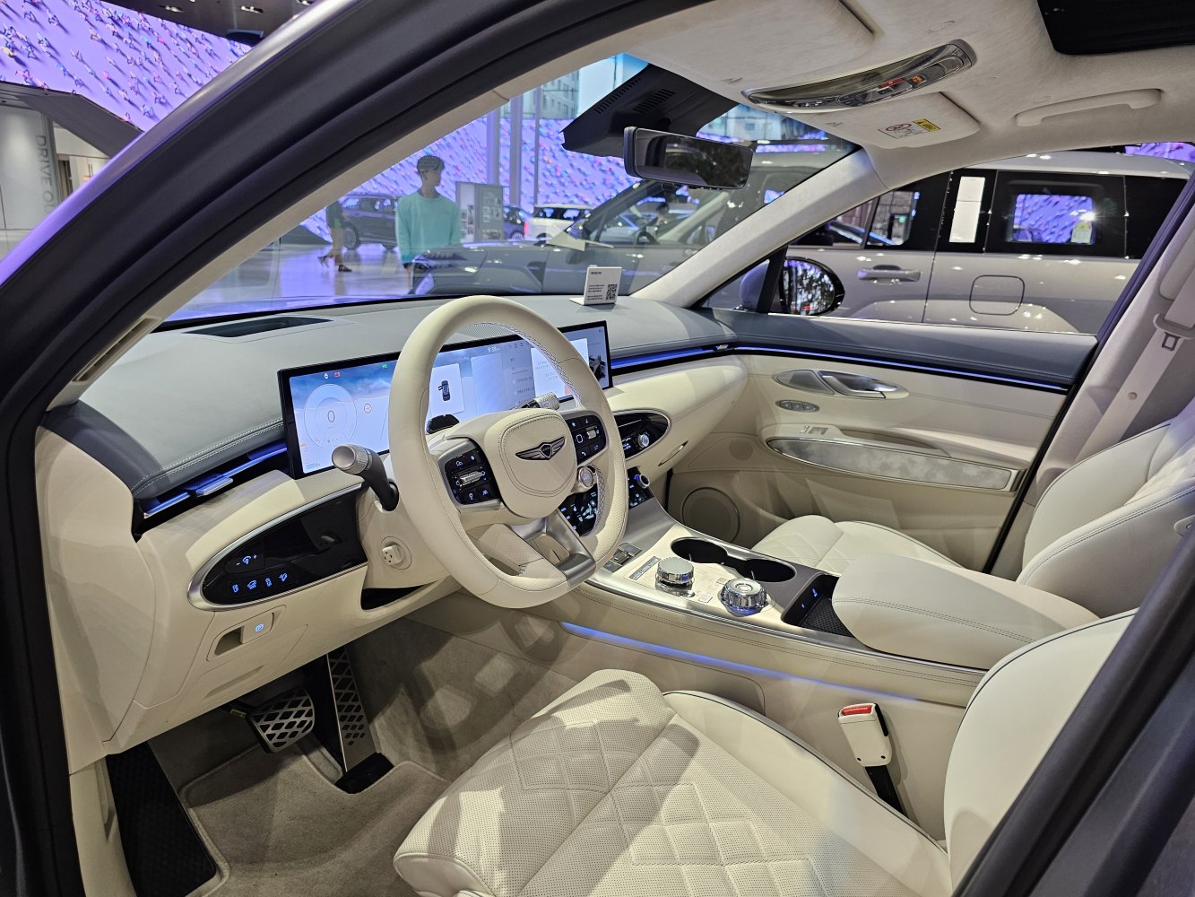 Luxury cabin with digital dashboard and beige leather upholstery