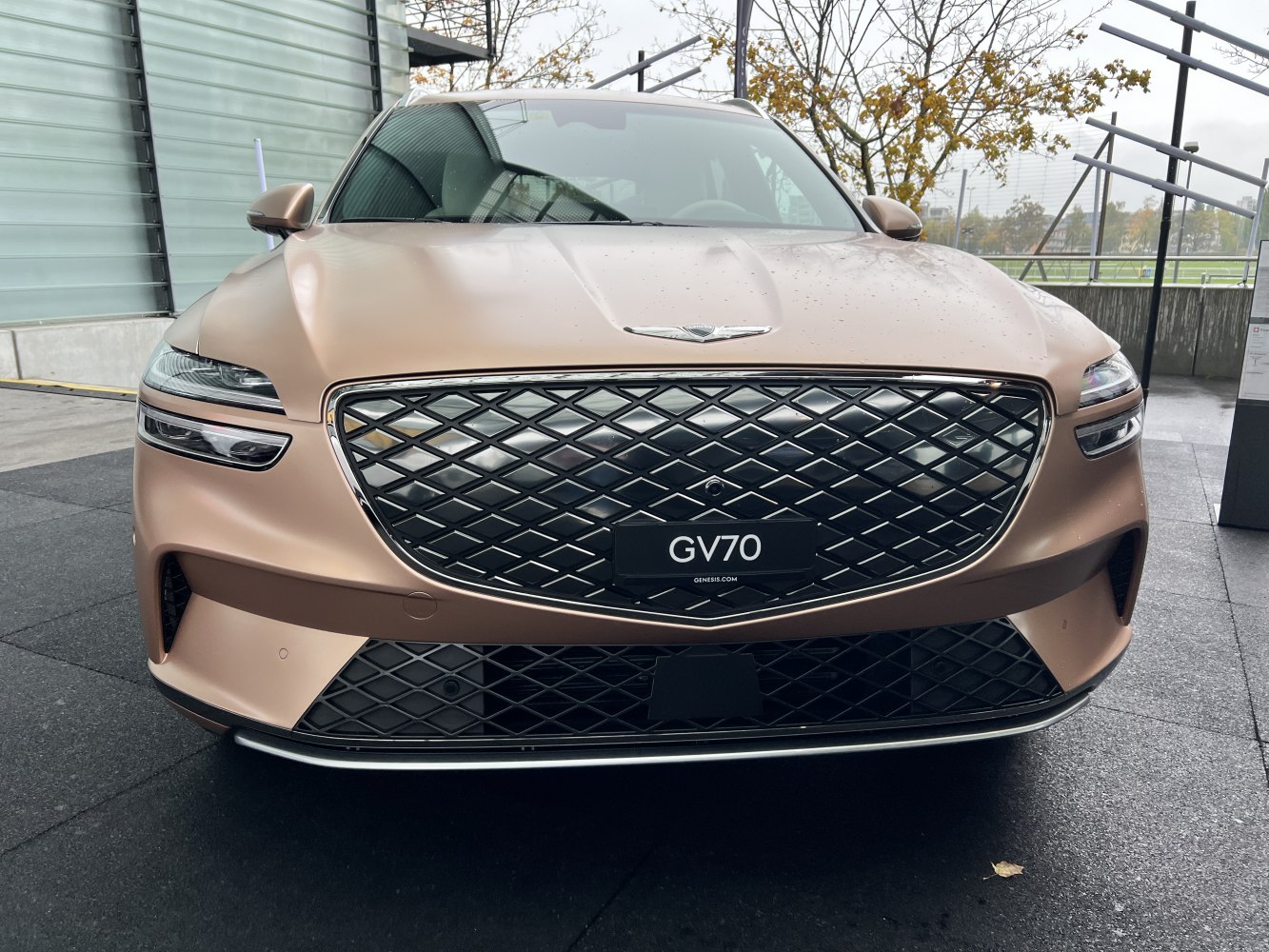 Large diamond-pattern grille and split LED headlights on 2021 Genesis GV70