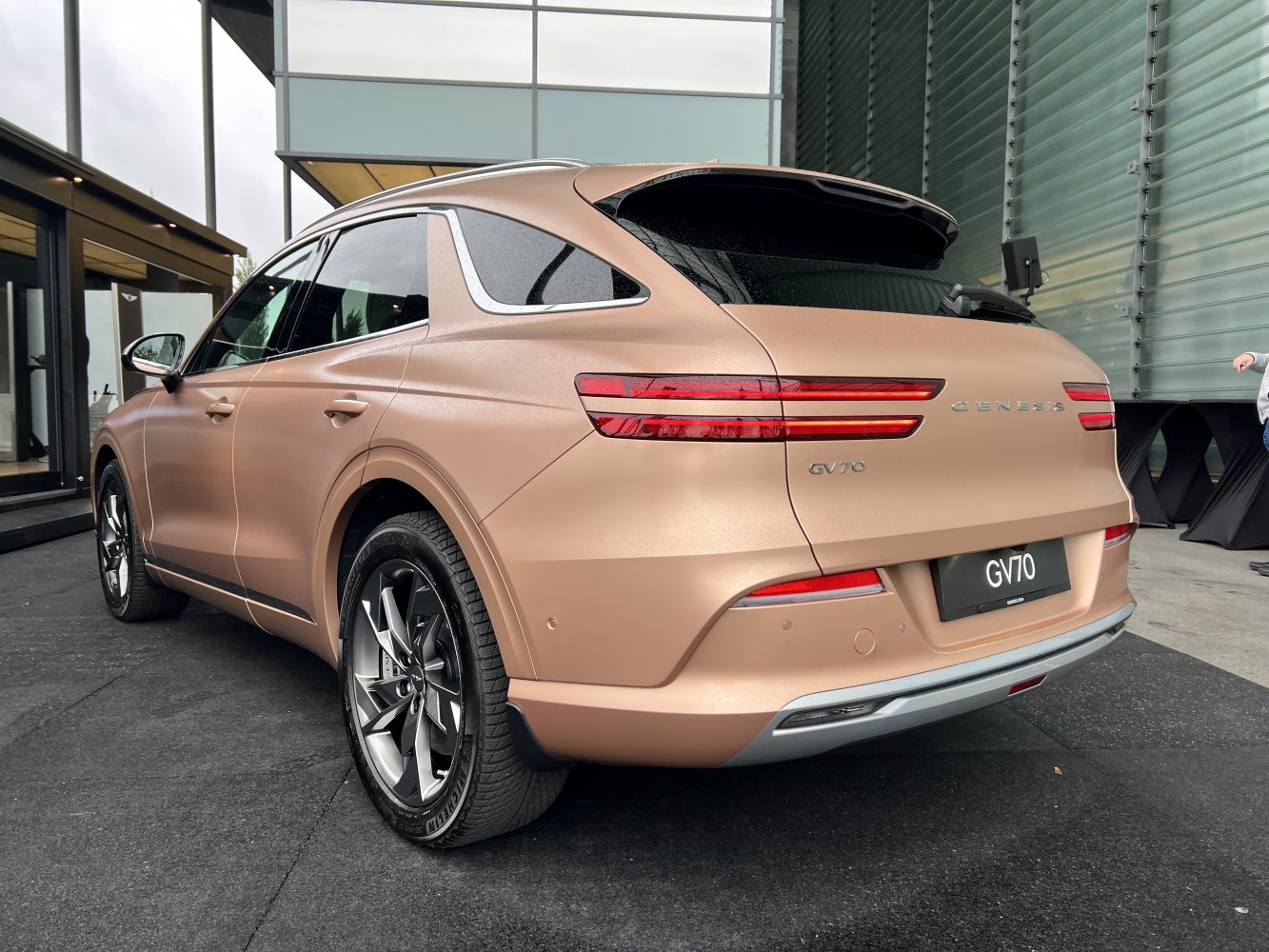 Rear and side view with sleek tail lights and alloy wheels