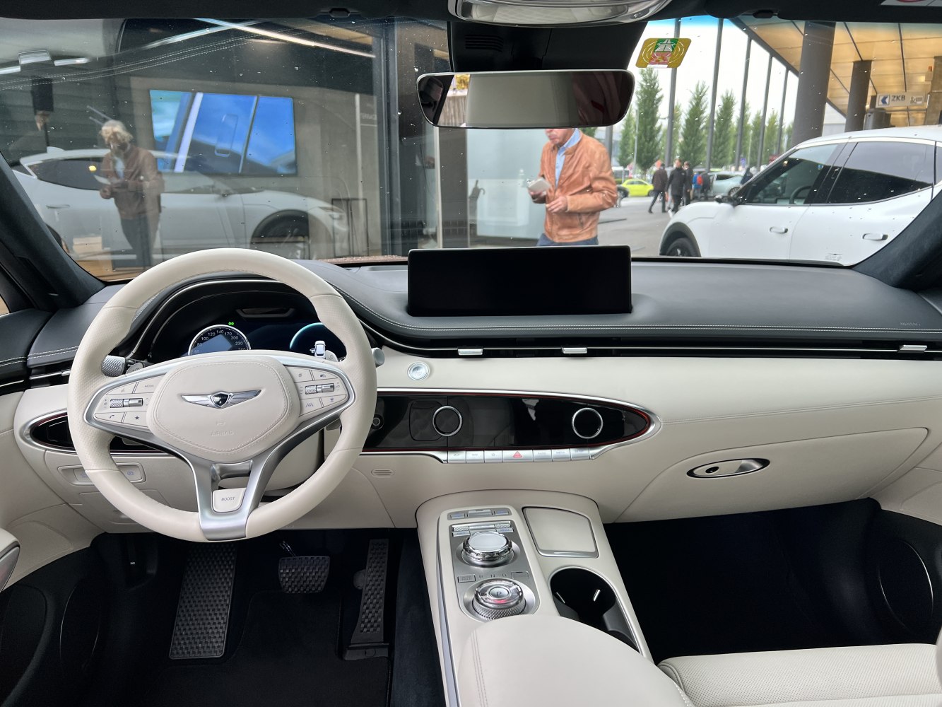 Modern dashboard and multi-function steering wheel in luxury SUV interior