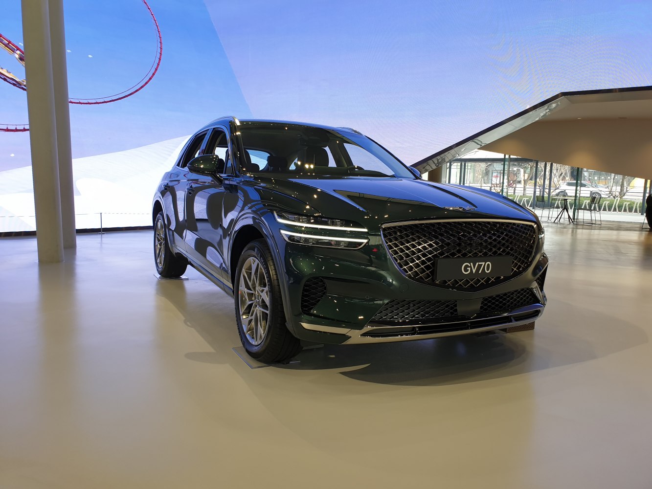Front view of modern SUV with mesh grille and slim LED headlights