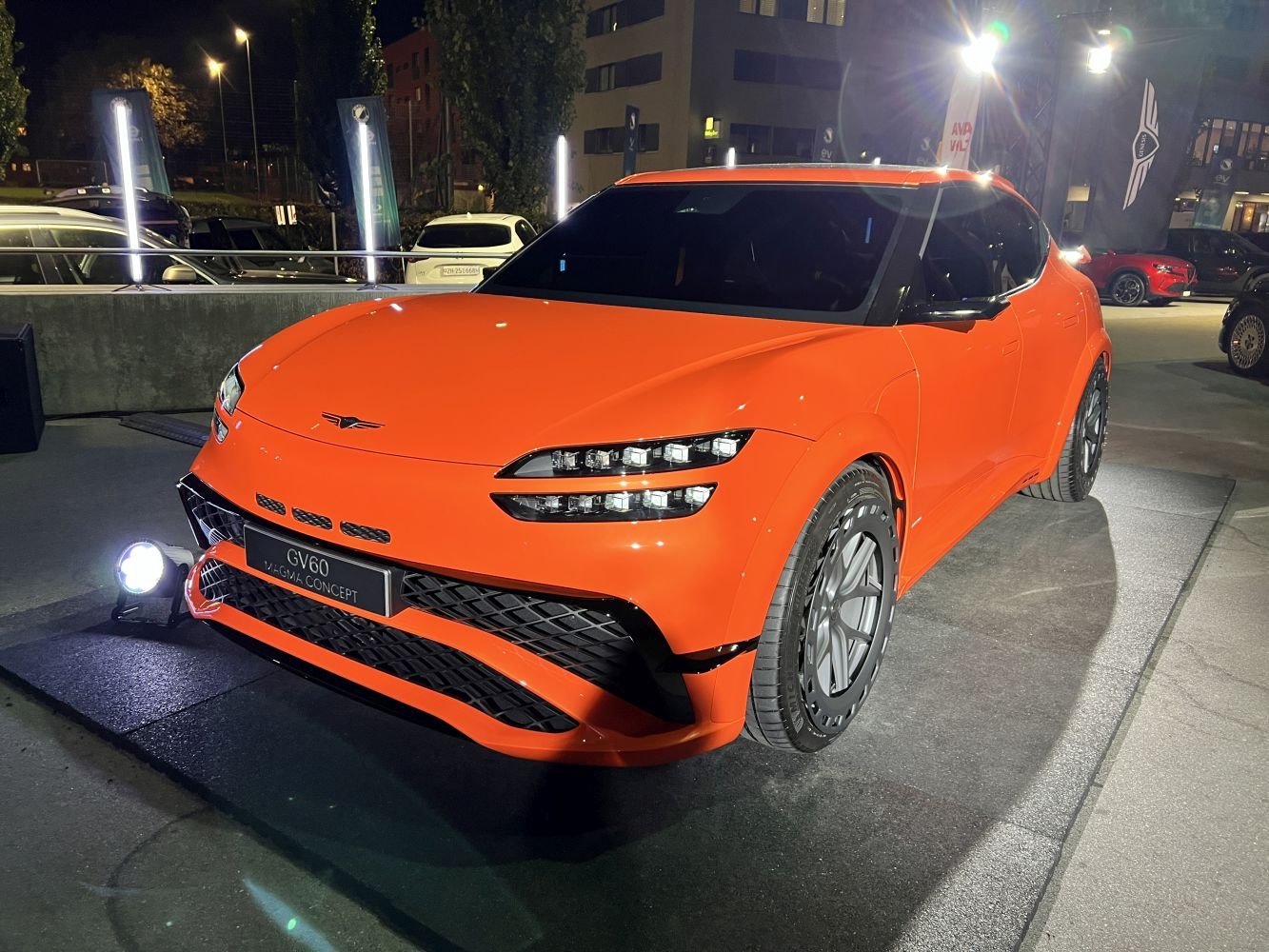 Futuristic SUV with split LED headlights and aerodynamic orange body