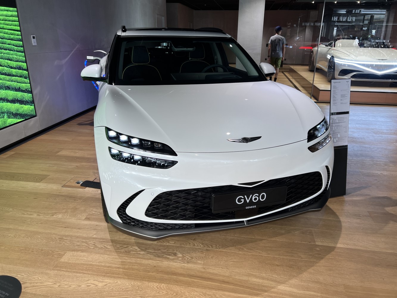 Front with LED headlights and bold black grille in white finish