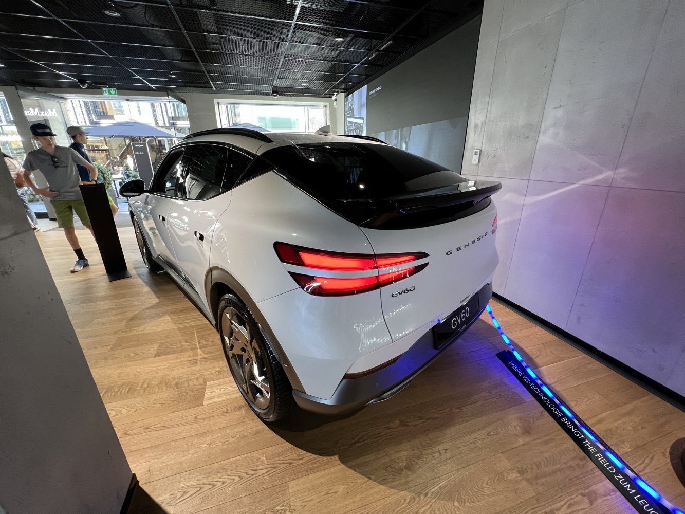 Rear and side view of an electric SUV with distinctive tail lights and sleek aerodynamic design.