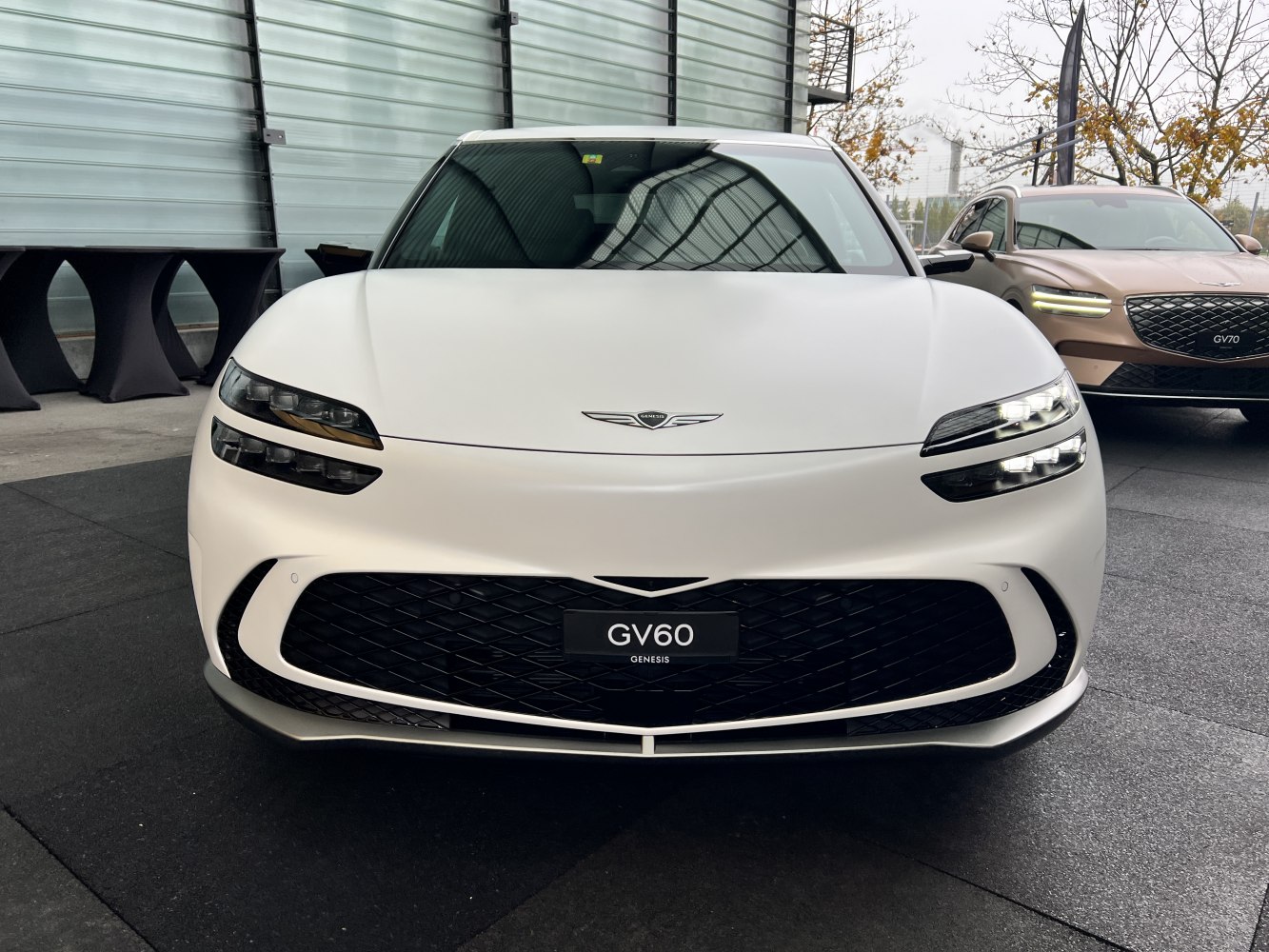 Front view with split LED headlights and wide grille