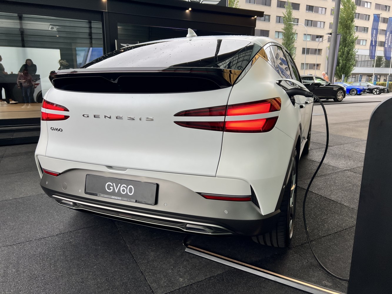 Rear view with LED taillights and charging port of a modern electric vehicle.