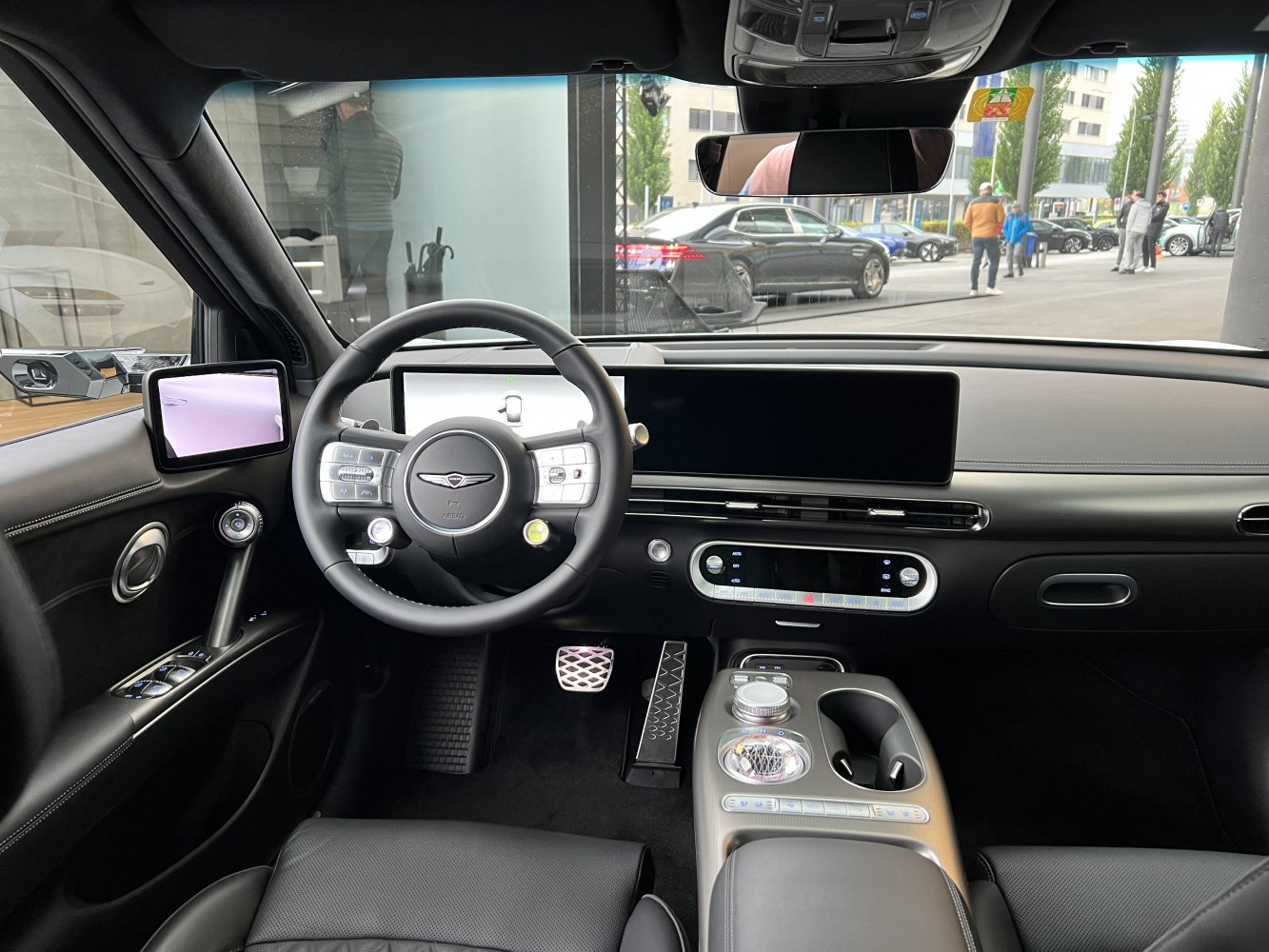 Modern car interior with digital dashboard and steering wheel controls