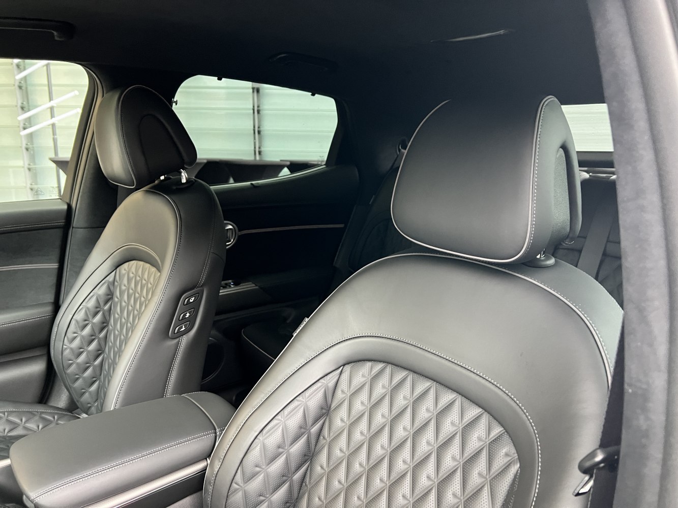 Quilted leather front seats with diamond pattern and contrast stitching