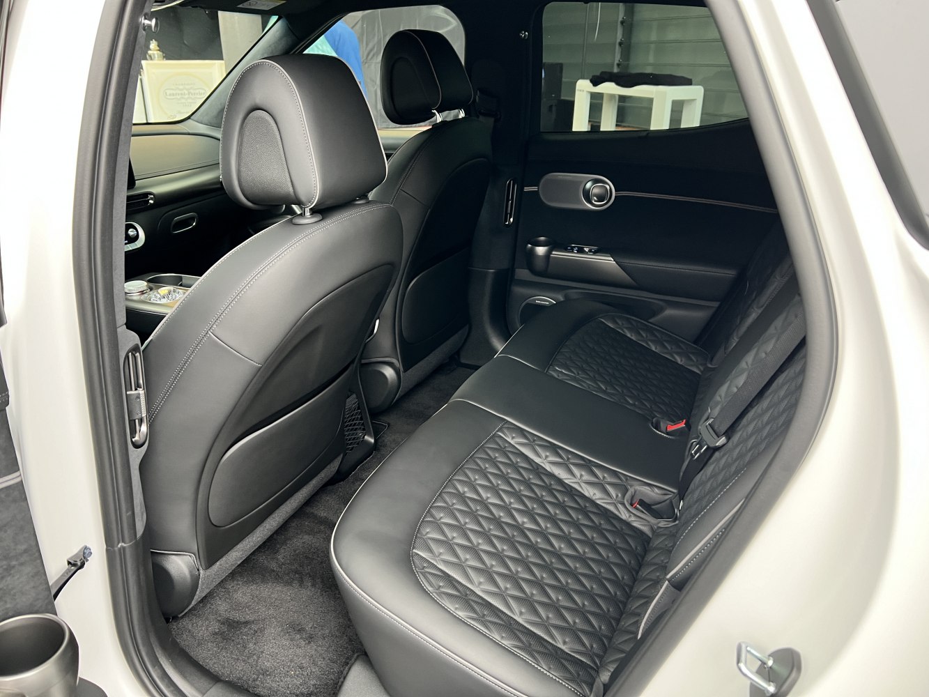 Quilted leather rear seats with modern door panel and interior design