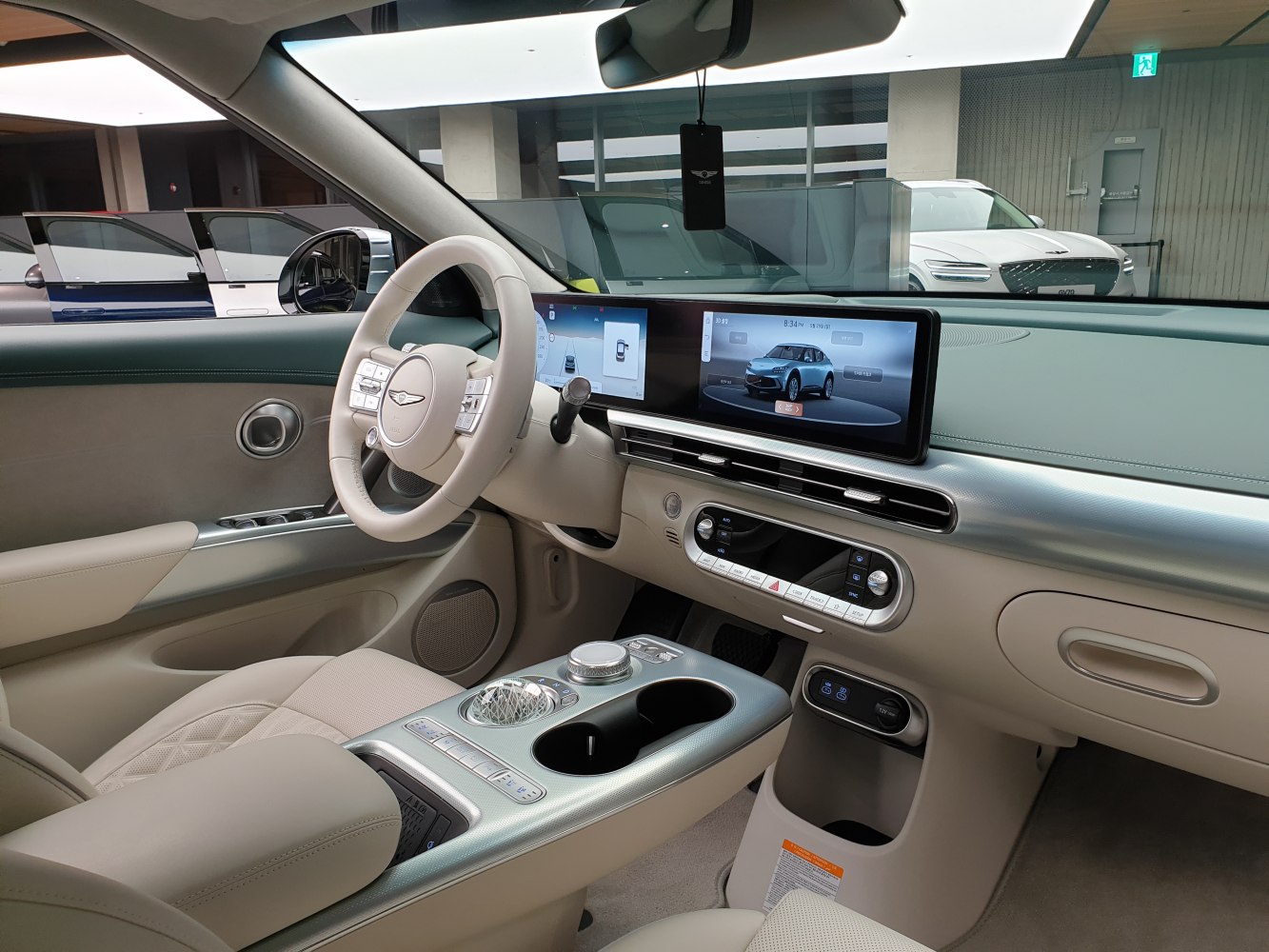 Dual digital displays and modern center console in luxury car interior