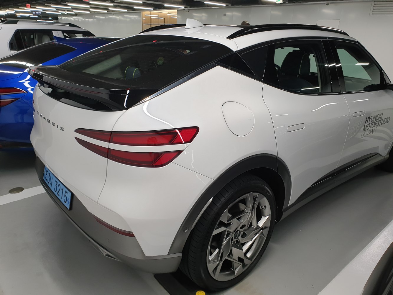 Rear view with aerodynamic taillights and futuristic alloy wheels