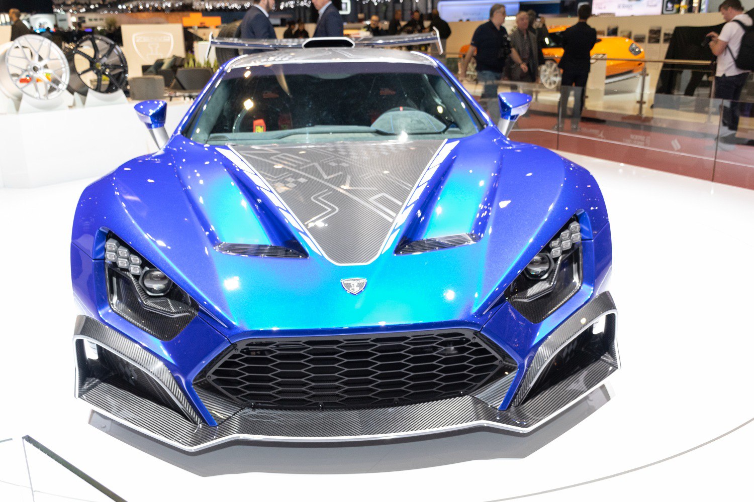 Front view with aggressive headlights and carbon fiber hood.