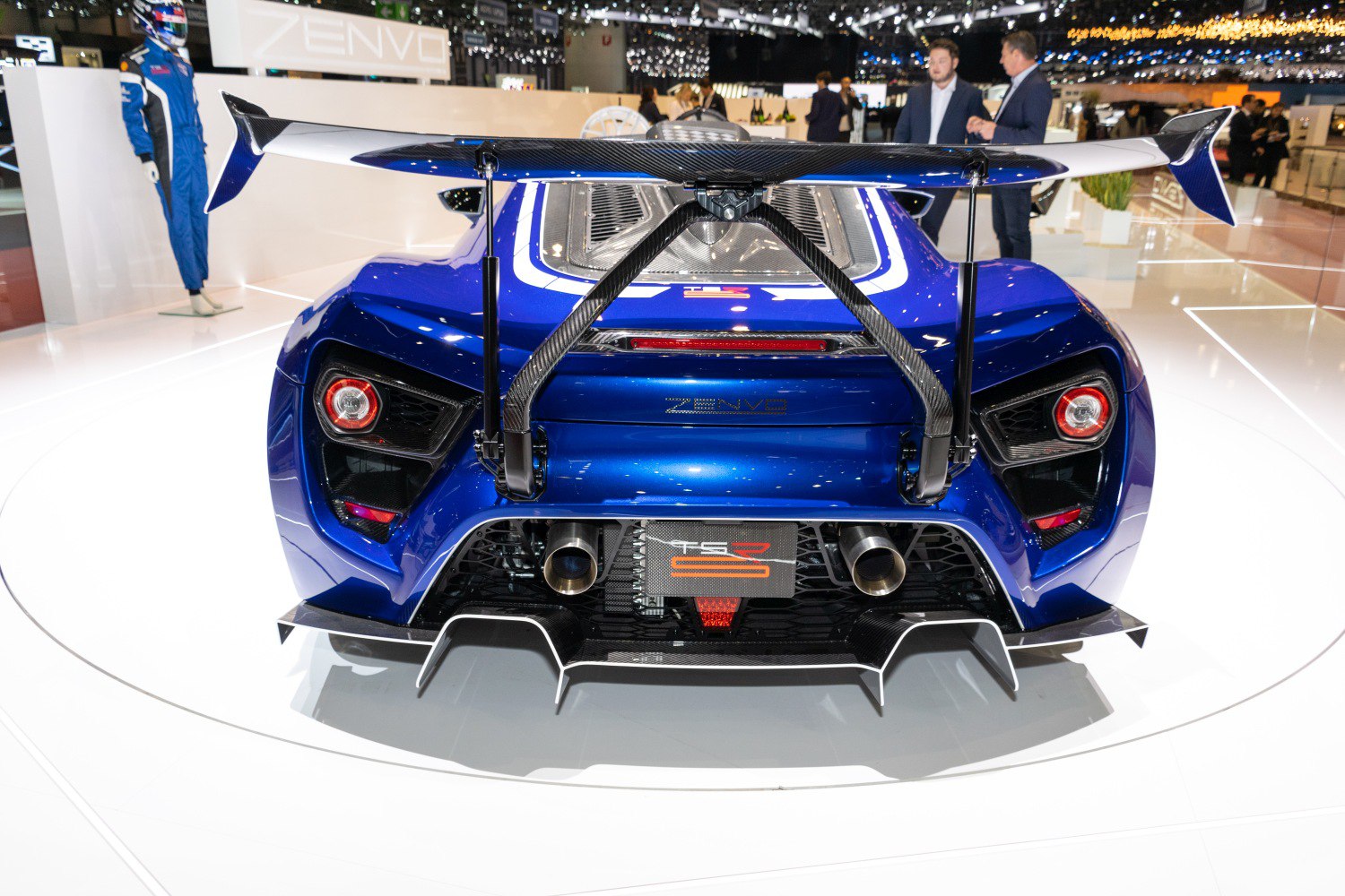 Rear view with carbon fiber spoiler, dual exhaust, and aerodynamic diffuser